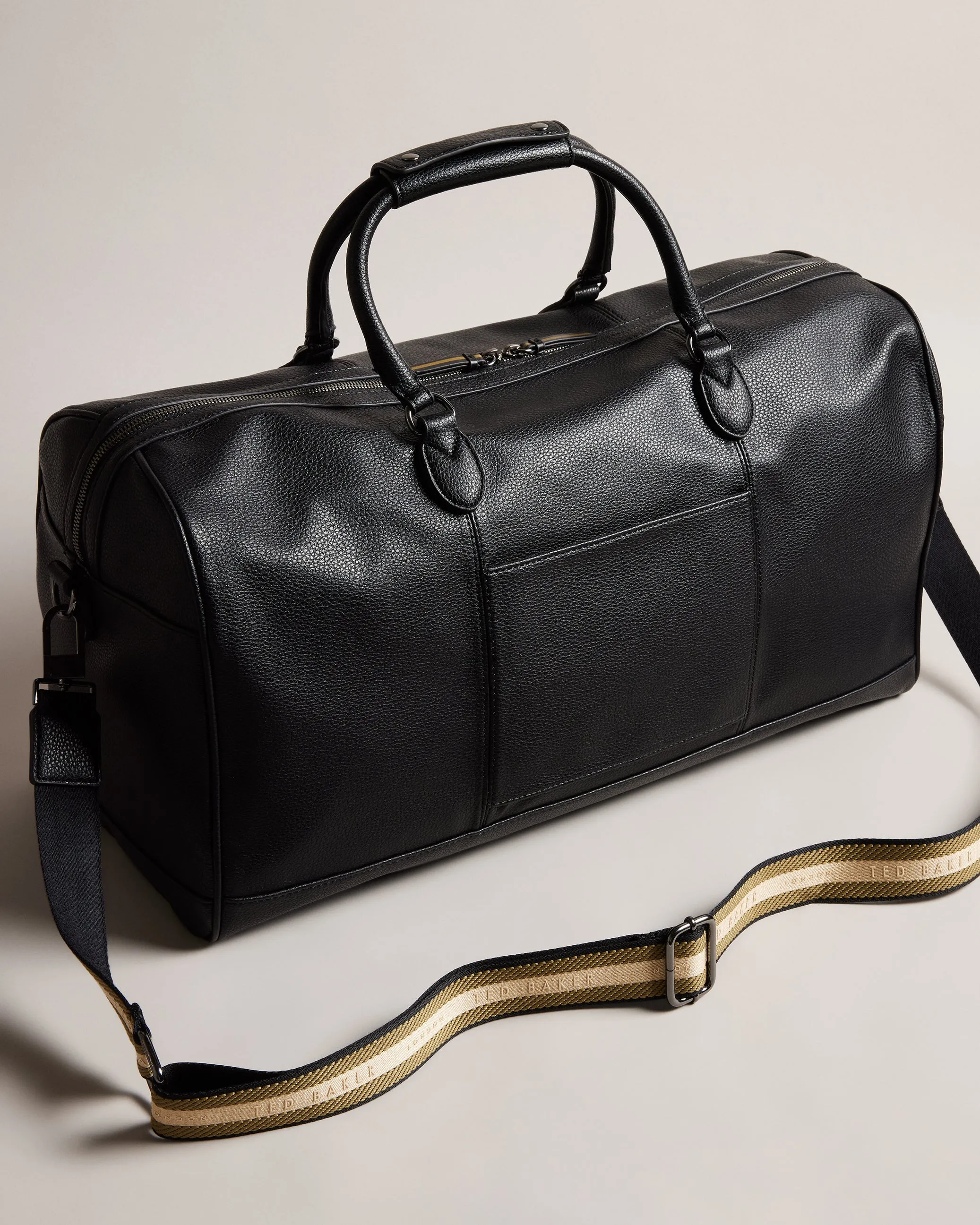 Kalvin Faux Leather Webbing Strap Holdall
